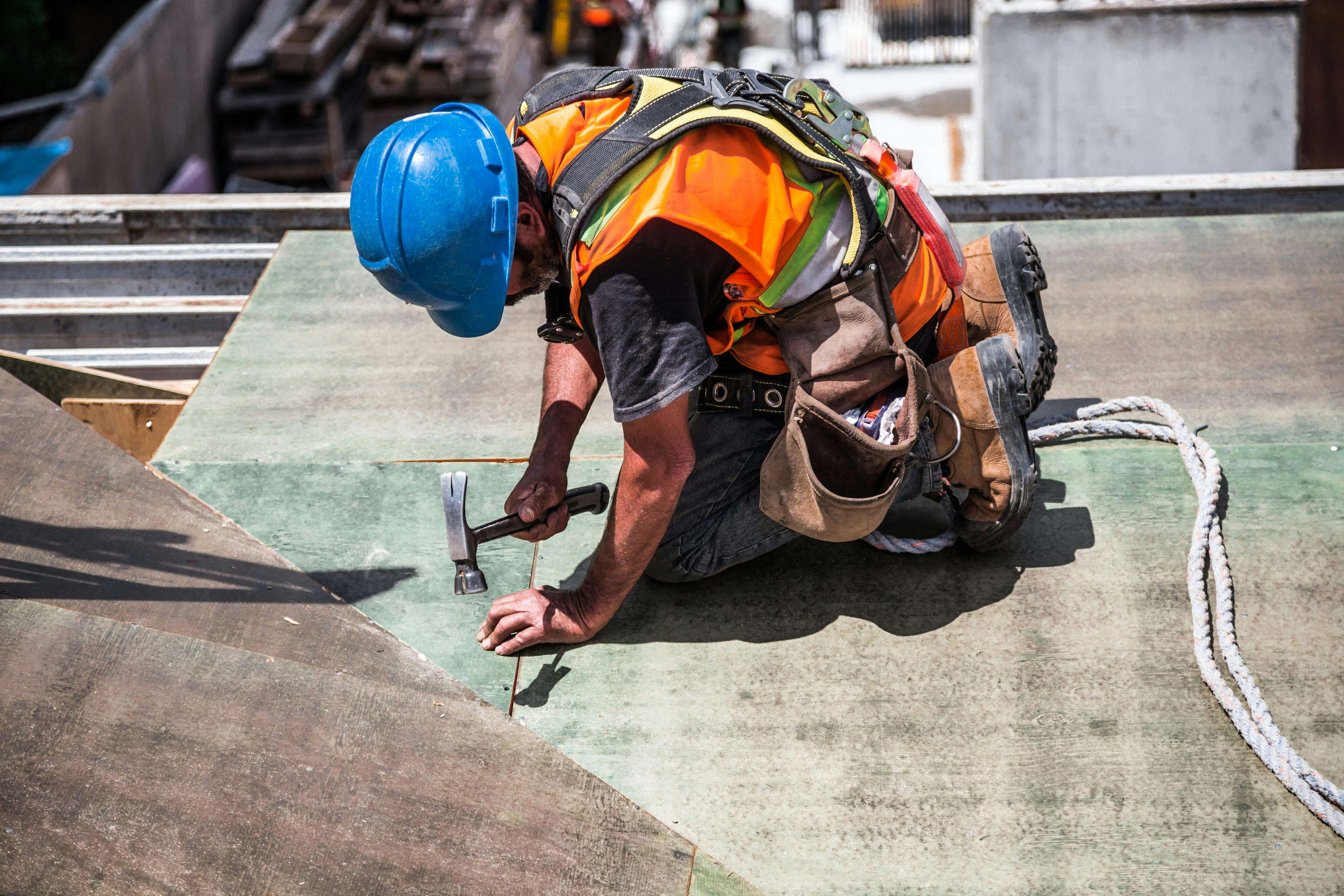 Construction worker carrying out structural repair work