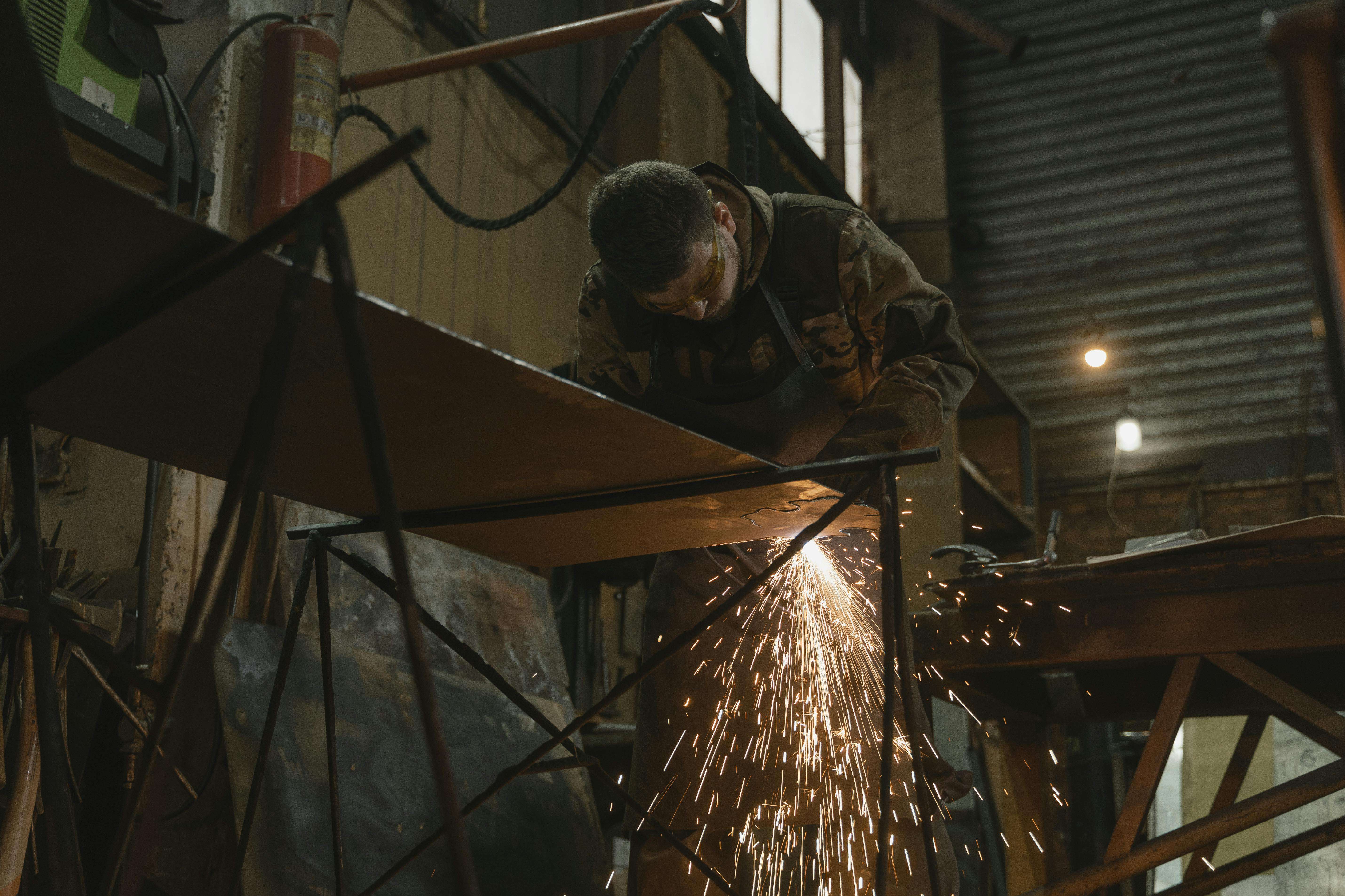 Industrial worker applying protective coatings in a workshop