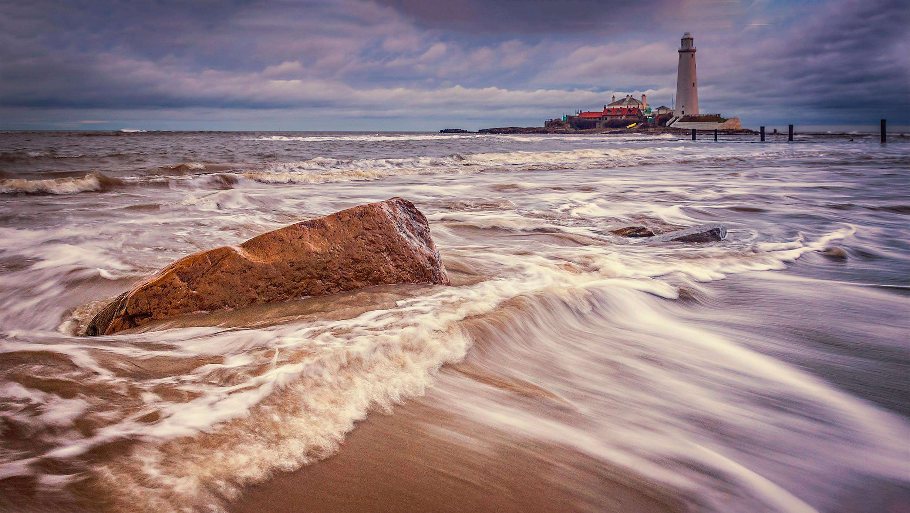 Lowestoft lighthouse against a dramatic coastal sky