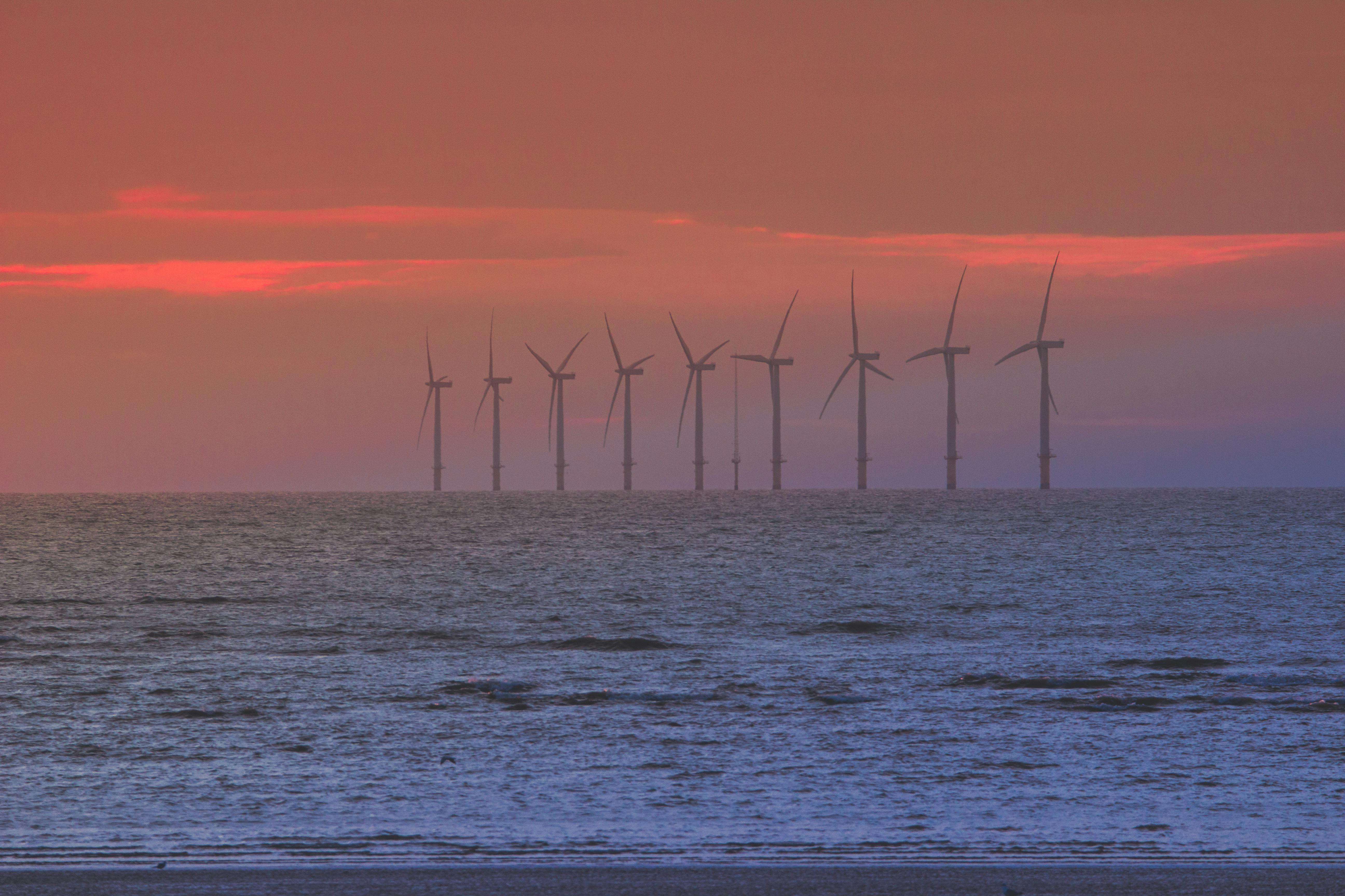 Rope access technicians maintaining a wind turbine